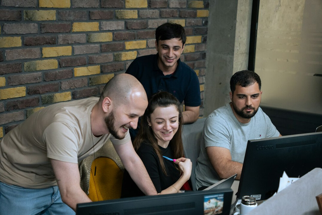 team discussing software code